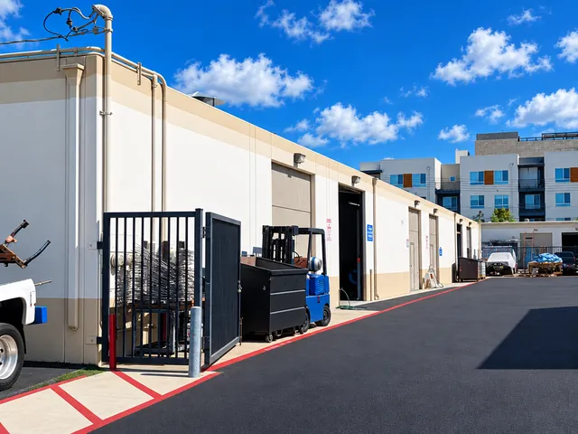 Service bay doors along the rear drive at Sal's Auto Service in Fullerton