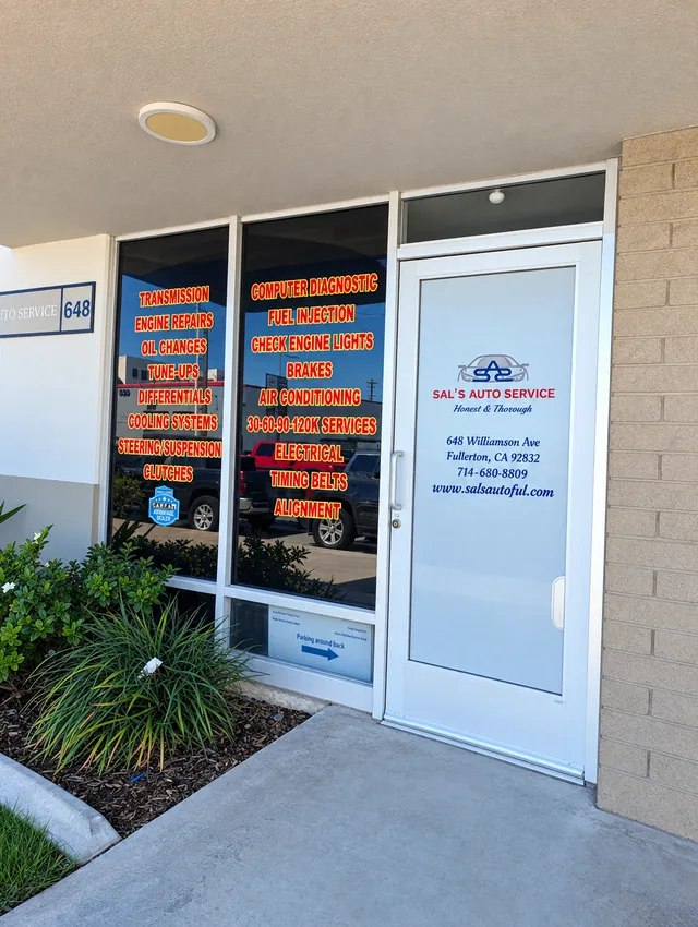 Front door of Sal's Auto Service with the address and phone number